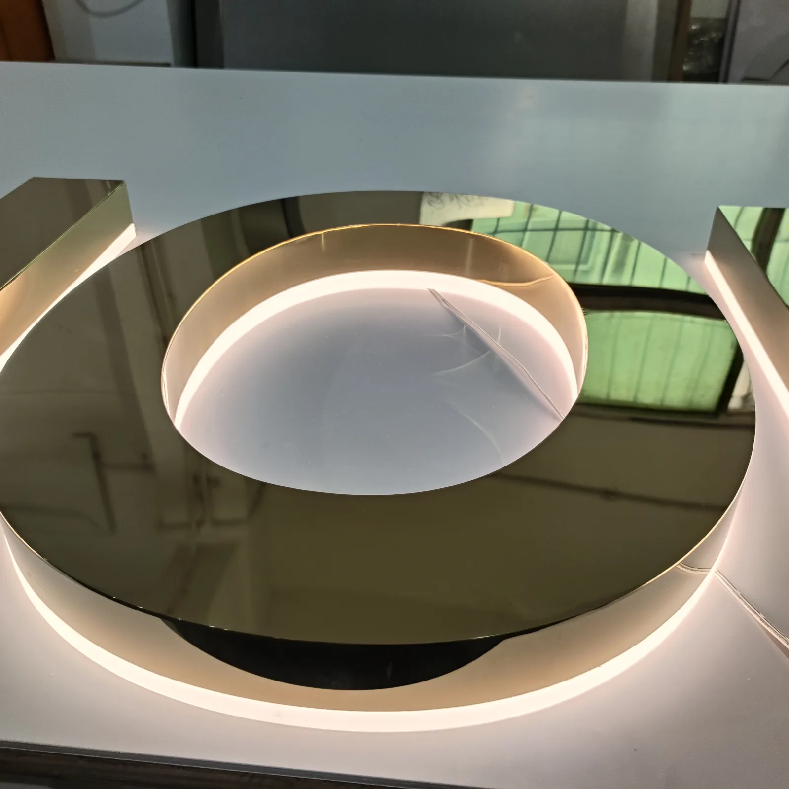 3500K warm white backlighting behind a gold sign letter
