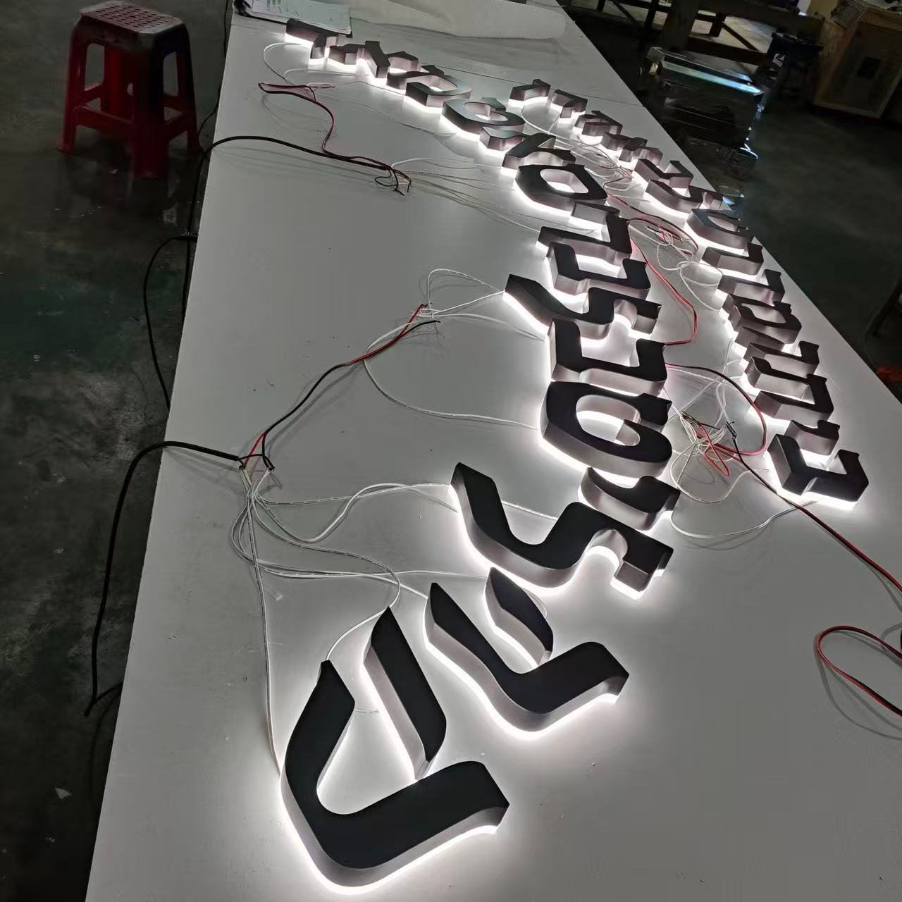 custom halo lit letters undergoing workshop testing